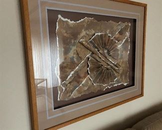 Retro paper artwork framed in shadow box.