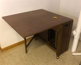 Table that stores 4 folding chairs