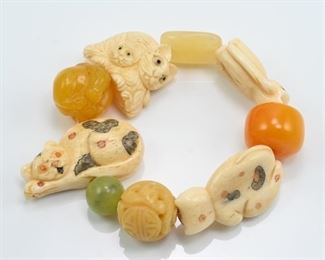 Cat netsuke & carved amber bracelet