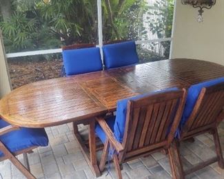 OUTDOOR TEAK PATIO SET WITH FIVE TABLES AND STEAMER DECK CHAIRS. $700.00