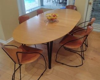 SCAN DESIGN DINING ROOM TABLE WITH SIX LEATHER AND METAL CHAIRS.  SHOWN WITH ONE LEAF IN TABLE.
$1200.00