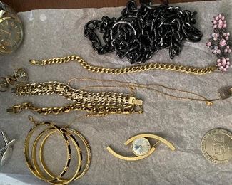 SOME OF THE MANY PIECES OF JEWELRY 