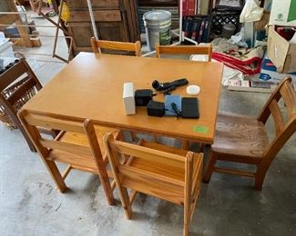 Very sturdy child's table with 4 matching chairs. 2 small library chairs heavy and well-built) sold separately
