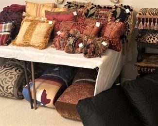 Big selection of pillows and stools
