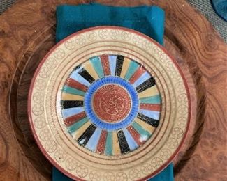 Rust chargers and colorful plates and napkins