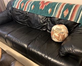Black sofa; blanket