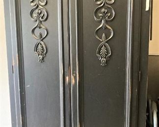 Black TV or clothing armoire