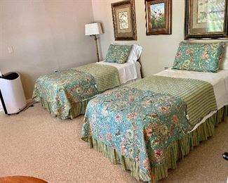 Twin beds, nice quilted bedspreads, oil on canvas center bird picture and other art work.