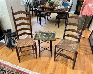 Two ladder back chairs,  metal toile painted table 
