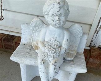 concrete angel on bench
