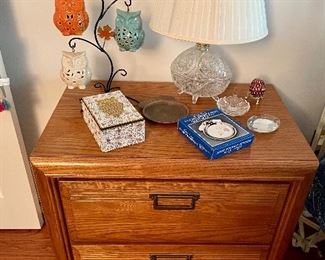 pair of oak nightstands, crystal bedside lamps, luminated owls on a stand
