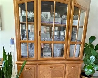 1 of 2 oak lighted china cabinets