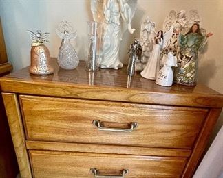 pair of oak 3 drawer chests, lots of angel figurines