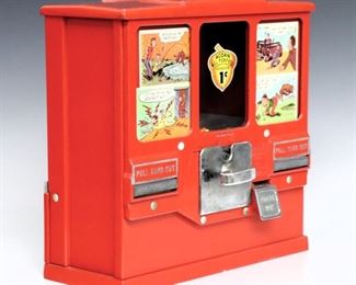 A 1960's Acorn "Premiere Gum and Card Vendor" penny candy machine with key.  Cast Aluminum construction with three glass panels over coin slots and card vending trays.  Original Red enameled finish with some wear.  13" high.  ESTIMATE $200-300