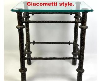 Lot 84 Small Iron and glass table Giacometti style.
