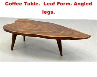Lot 97 Thick Top Freeform Slab Coffee Table. Leaf Form. Angled legs. 
