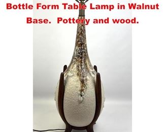 Lot 122 MID CENTURY MODERN Bottle Form Table Lamp in Walnut Base. Pottery and wood.