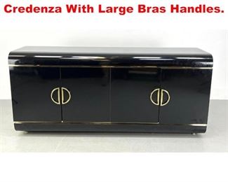 Lot 214 Italian Style Black Credenza With Large Bras Handles. 