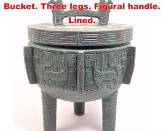 Lot 492 Tribal Relief Design Ice Bucket. Three legs. Figural handle. Lined. 