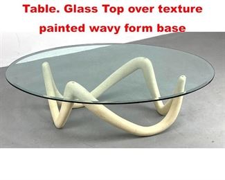 Lot 548 Decorator Modernist Coffee Table. Glass Top over texture painted wavy form base