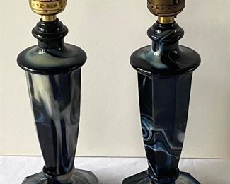 Pair of Globe Specialty Company Cobalt Blue Swirl Slag Glass Lamps each measuring 12". One appears to have a new socket while neither lamp has a cord. 