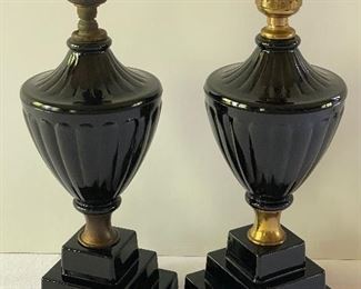 Pair of Black Art Deco Houze Glass Lamps with the unique step base design. Each lamp measuring 13" and one looks to have a new socket. These lamps do NOT have the electrical cords.