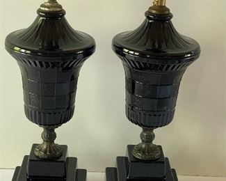 Pair of Art Deco Black Houze Glass Lamps with the step base design. Each measures 14". One of the lamps has a repaired "foot" on the base and one appears to have a new socket. Neither lamp in this lot has an electrical cord. 