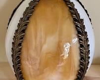 This pretty pendant shade measures 10 inches tall. The colored panels are plastic.