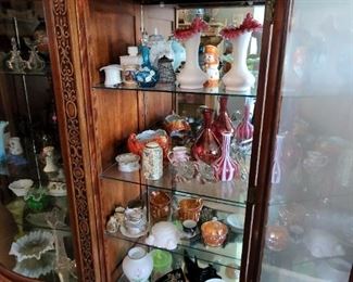 Display cabinet and glass