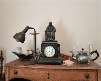 Cast metal clock and brass lamp
