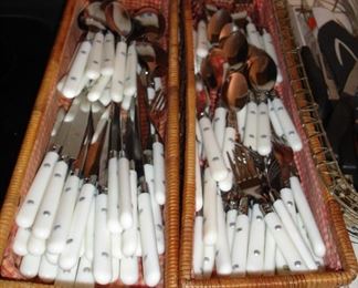 Large set of plastic handled flatware