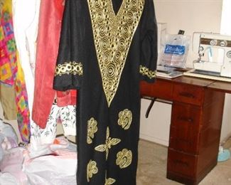 I like this caftan - there's  a nice leather jacket next to it - the bags are filled with clothing
