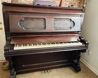 Antique Upright Piano by Merlin & Sons New York 
     Made exclusively for L. Grunewald  Co., Ltd. Of New Orleans, La
     