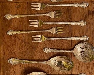 Vintage Sterling Silver Set 
   “English Gadroon”
Closeup of Appetizer Forks and Some of the Serving Spoons 