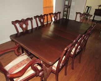 Carved mahogany table with 8 Chippendale chairs