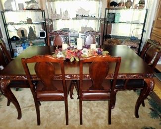 Traditional Dining Room Table set. Includes: Table with one large leaf, 4 side chairs, 2 arm chairs and complete set of custom table pads.