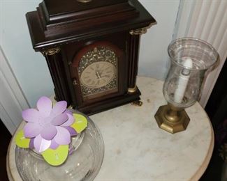 Marble top table and then you add a beautiful vase and clock