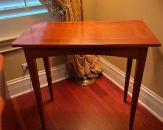 Inlaid wood table. Measures 32"W x 16.5"D x 30"H.