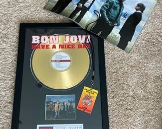 Bon Jovi Lot! Includes: framed 24k gold plated ‘Have A Nice Day’ record and band photo (limited edition- numbered 689/5000), Backstage Pass from 2008 Lost Highway Tour, and a 2007 Tour Book with all band member autographs! COA with purchase.