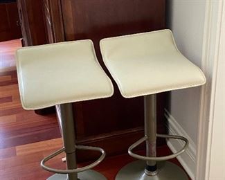 Pair of contemporary white leather and metal bar stools