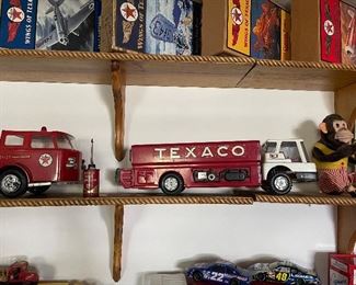 Catch a glimpse of the Vintage animated Monkey who rests on a shelf next to his favorite ride, a Texaco Truck! 