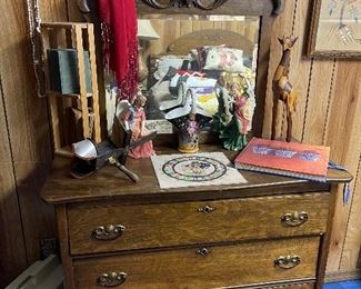 An Early 1900's Oak Dresser can be found in the basement bedroom.  The piece is in excellent condition and is very functional.  