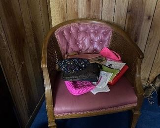 A Vintage 1970's Cane & Upholstered Side Chair awaits your arrival and is ready to add to your mid-century modern look.  