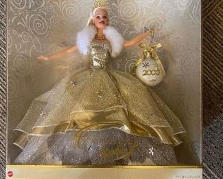 This Barbie who celebrates the year 2000 holds a Holiday Ornament to commemorate the occasion.  Doll is MIB and priced to sell.  