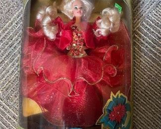 Happy Holiday Barbie is in classic red and is MIB and ready to go home with you as a nice addition to your collection.  