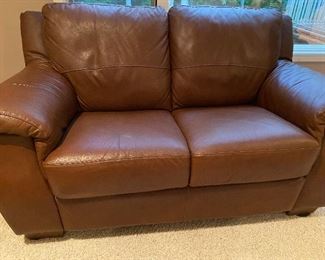 All leather loveseat in a lovely cognac brown 