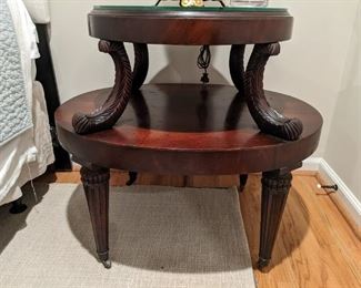 LOVE this pair of 1930's hand-carved mahogany side tables, with tooled leather and glass protector tops. 