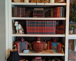 Here's the other bookshelf, with Asian porcelains, vintage bookends, vintage wooden cigar boxes and Longaberger baskets. 