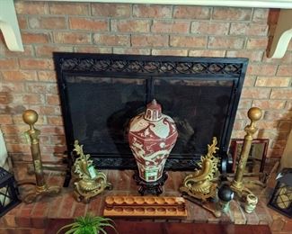 Pair of wonderful, vintage brass andirons, large Asian porcelain lidded jar on wooden stand and hand-carved wooden marble game board.