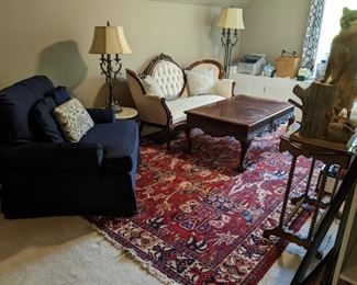 The other generously sized upholstered armchair, by Fairfield, banded/carved mahogany coffee table, Victorian swoopy couch, freshly upholstered, matching table/floor lamps, a very friendly taxidermied fox, all atop another wonderful Persian Bakhtiari rug. 
